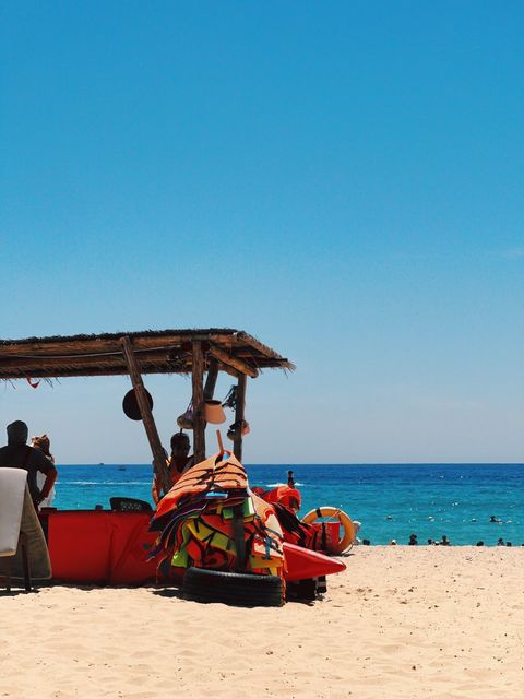 The same beach hut with deeper turquoise sea behind — shot on A GHX