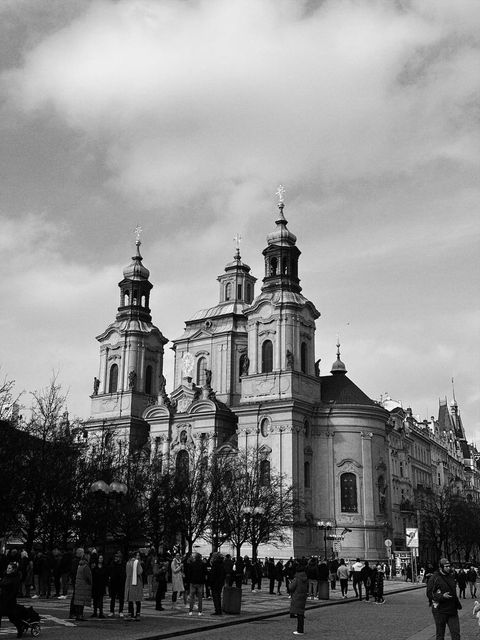 A baroque church on a busy square, in black and white — shot on B DAU